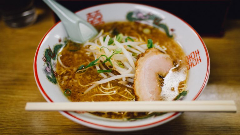 Chinese noodles with chopsticks and spoon