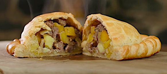 Inside of a pasty showing the filings of meat and vegetables