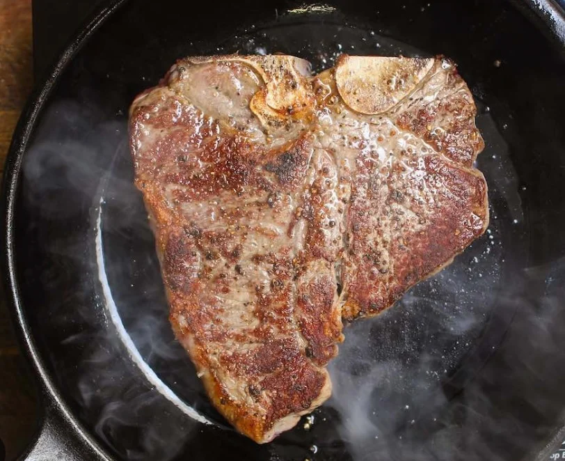 Porterhouse steak on pan