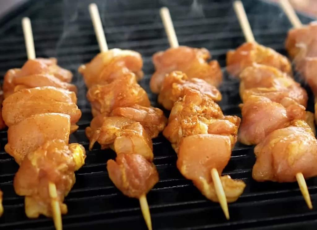 Diced, cubed or thin strips of folded meat pushed tightly together in each skewer