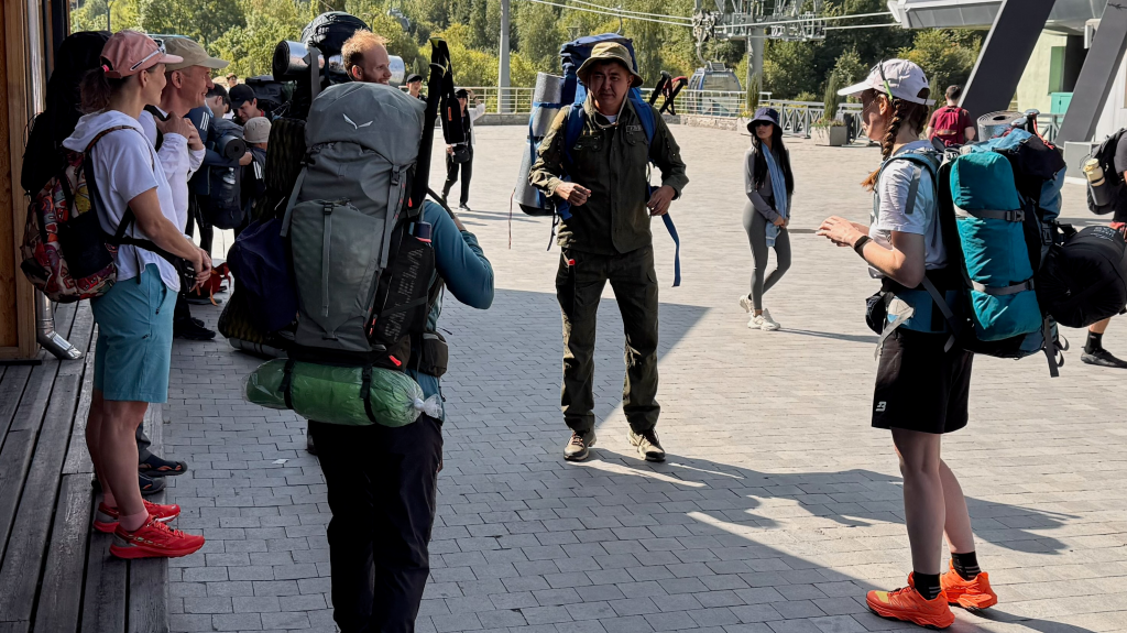 Hikers ready to head to the mountain trails of Shymbuka via the gondola.